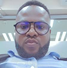 The symbolism in this photo is striking. Senyeuidzorm Adadevoh takes photos  at the launch of a report