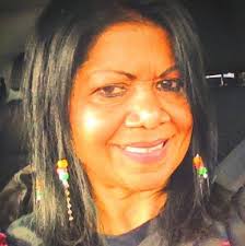 What tall plants can be added in front of cucumber trellises?