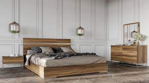 In the master suite, custom side tables made of vintage card catalogs flank a dark gray and blue bookcase laid out in a herringbone pattern that takes up the entire wall behind the upholstered headboard. Modern Light Wood Bedroom Set Novocom Top