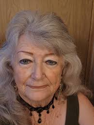 What hairstyle and makeup suggestions do you have for a 73-year-old woman?