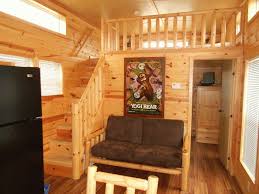 rustic clear varnished oak teak wood loft bunk bed with walk in closet underneath having staicase with banist loft bed plans small cabin interiors diy loft bed
