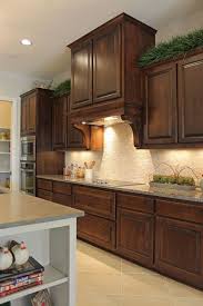 Burrows Cabinets Kitchen Cabinets In Stained Knotty Alder And Custom Wood Georgian Ven Stained Kitchen Cabinets Kitchen Cabinet Layout Custom Kitchen Cabinets
