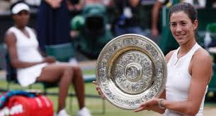 The venus rosewater dish is the ladies' singles trophy awarded at the championships, wimbledon, and was first presented to the champion in 1886.a rosewater dish is a ceremonial platter or basin used after eating to catch rosewater poured from warm or cold ewers over the hands to wash them, which was a daily ceremony in england. Muguruza Stuns Venus To Win First Wimbledon Title