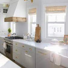 The downside of using wood as kitchen hood material is its. White Wood Range Hood With Oak Trim Design Ideas