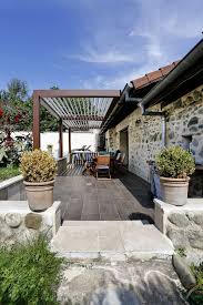 Douceur De Vivre Au Quotidien Sous Votre Pergola Bioclimatique Biossun Biossun Pierre Pergolas Pergola Building A Pergola Pergola Designs