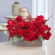 Stunning Red Blooms Astilbe Roses Amaryllis And Dried Bougainvillea Flower Delivery Amaryllis Bloom