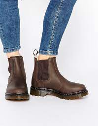 They were primarily worn as workwear however they found their way in to mainstream. Dr Martens Leonore Brown Lined Chelsea Boots At Asos Com Brown Chelsea Boots Brown Chelsea Boots Outfit Chelsea Boots