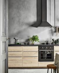 Lower Cabinets Of Light Colored Wood And A Concrete Wall Look Interesting And Contrasting Concrete Kitchen Minimalist Kitchen Ikea Kitchen