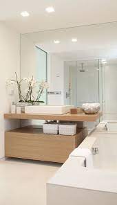 The full wall of mirror in this bathroom reflects the light streaming in from above and makes the already bright bathroom even brighter. 30 Cool Ideas To Use Big Mirrors In Your Bathroom Digsdigs
