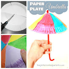 The first step is to cut the paper plate in half. Paper Plate Umbrella Craft The Pinterested Parent