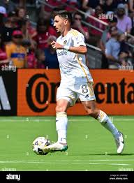LA Galaxy midfielder Marco Delgado (8) heads the ball over Real Salt Lake  midfielder Diego Luna (26) during the second half of an MLS soccer match in  Carson, Calif., Saturday, Oct. 1,