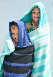 Starting with bottom edge of towel, straight stitch both long sides of ribbon to towel, stitching as close to ribbon edges as possible. A Diy Hooded Towel That Your Kiddo Won T Immediately Outgrow Project Nursery