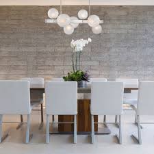 This metal chandelier hanging over the dark wood table, close to the dark panel wall adds a bit of drama to the otherwise moody room. Lighting Options For Low Ceilings Flushmount Lighting Ideas At Lumens Com