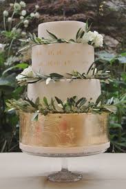 Gold Leaf And Calligraphy Wedding Cake With Blossoms And Olive Leaves Includes Lyrics To The Firs Calligraphy Wedding Cake Pretty Wedding Cakes Wedding Cakes