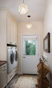 I love how the plywood shelves were installed for rolling baskets and glass pendant lighting. Modern Farmhouse Laundry Room Ideas Pickled Barrel Farmhouse Laundry Room Laundry Room Lighting Farmhouse Laundry