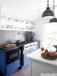 A White Farmhouse Kitchen With Splashes Of Blue White Kitchen Decor Kitchen Design Kitchen Trends