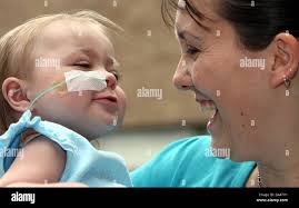 Zoe Chambers, aged 19 months, from Hull with mother Julie leaving The  Freeman Hospital, Newcastle after undergoing a life saving heart transplant  operation Stock Photo