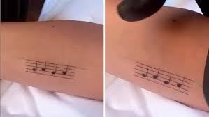The first beat after each. Lady Gaga Quickly Fixes Mistake On New Music Note Ink After Getting Two V Day Tattoos Daily Mail Online