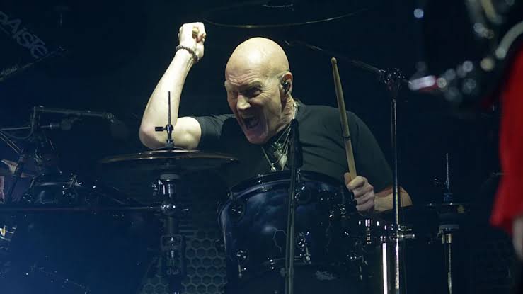 Former AC/DC drummer Chris Slade retires at 79