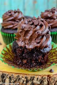 A decadent chocolate cake that also uses up your abundance of zucchini? Zucchini Chocolate Cupcakes Greedy Eats