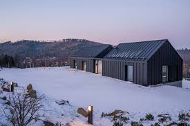 The metal roof company supplies zinc, copper & steel roofing material to metal roofing contractors nationwide, including greencoat plx and lindab guttering. Modern Mountain House Clad In Black Metal And Concrete Curbed