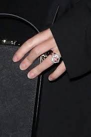 The pink padparadscha sapphire, surrounded by diamonds, is similar in style to the ruby engagement ring her dad, prince andrew, gave to sarah ferguson when he proposed in 1986. Princess Eugenie Beams As She S Spotted For The First Time Since Windsor Wedding New Idea Magazine