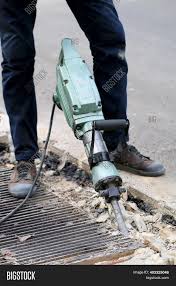 Horizontal boring augers drill under sidewalks, foundations and more using your heavy duty electric drill. Male Workers Use Image Photo Free Trial Bigstock