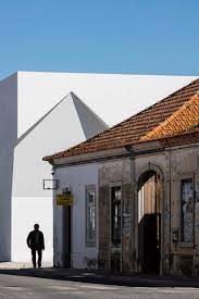 The price is $84 per night from mar 19 to mar 20$84. Irregular Cutouts Mark Entrances To Aires Mateus Community Centre In Portugal