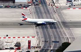 Gibraltar international airport or north front airport is the civilian airport that serves the british overseas territory of gibraltar. Gibraltar Airport Strange Runway Intersecting A Road Charismatic Planet