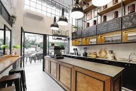 The Black And White Interior With Brut Surfaces Like Plaster Concrete Bricks Combined With Black Coffee Shop Design Coffee Shops Interior Coffee Shop Decor
