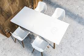 So, it will be a white kitchen table and chairs. Top View Of White Dining Table With Four Chairs Standing In Dining Stock Photo Picture And Royalty Free Image Image 113587589