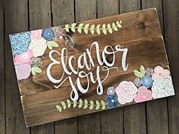If our artist has questions or concerns regarding your sign design they will call you or send you an email. Nursery Name Sign Rustic Wood Nursery Sign Flowers Boho Chic Etsy Nursery Wall Decor Girl Nursery Signs Boho Chic Nursery
