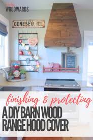 Contemporary wood range hood featuring horizontal shiplap paneling and a stainless baffle base. Barn Wood Range Hood Cover The Finishing Touch Newlywoodwards