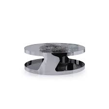 The legs intersect on the floor in the center of the table. Modern Chrome And Glass Round Coffee Table Stark