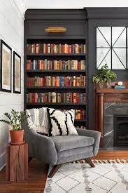 Love All These Books Placed On Shelves And The Color Of The Wall Is Dark And Moody Living Room Decor Book Place Moody Living Room Home Decor House Interior