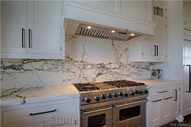 Granite counters w/ white brick backsplash, stainless steel appliances, wood floors (parade of homes). Are There Rules About Using Counter Material As Backsplash
