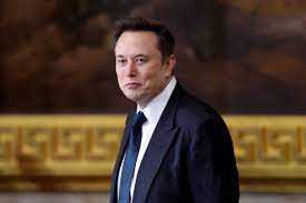 Musk tells Tesla employees hang on to stock after 50% plunge | Fortune