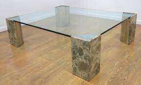 The dana coffee table is the perfect balance between intricate pattern and organic lines. Modern Glass Top Chrome Stone Base Coffee Table