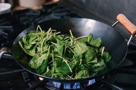 I scrubbed off the coating it came with using a scouring pad, and then heated it on a high btu stovetop until it turned a nice blue. How To Season A Wok And Daily Wok Care The Woks Of Life