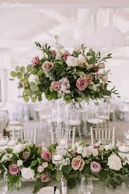 Elegant Garden Wedding With Shades Of Purple Elegantwedding Ca Flower Centerpieces Wedding Wedding Floral Centerpieces Wedding Table Centerpieces