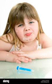 sick little girl is afraid of injections Stock Photo