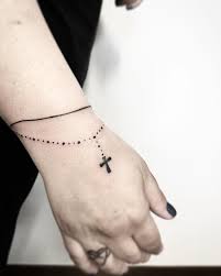 For a more masculine feel, most men opt for bold, solid black lines that complement their slender build. Bracelet Tattoo With A Cross Tattoo Bracelet Tattoo Designs Wrist Ankle Bracelet Tattoo