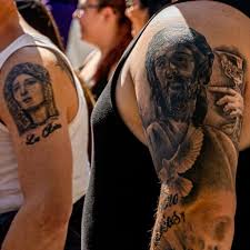 The tattoo appears in a circular motion tatted in solid grey and black ink. 20 Most Popular Tattoo Styles Self Tattoo