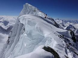Ice block above bottleneck that can tumble down anytime on the bottleneck, climbers have to traverse 100 meters exposing themselves to risk. K2 And Broad Peak Flash Furtenbach Adventures