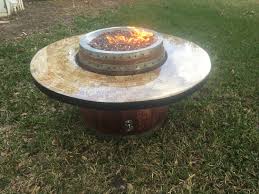 The coffee table top was created by coincidence since the creator already had a diy cork board for pinning up items. Wine Barrel Coffee Table Gas Fire Pit With Cork And Epoxy Resin Top And Raised Burner