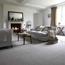 Keep Warm In A Welcoming Rustic Lounge With A Comforting Fireplace Cosy Interior Design Grey Carpet Living Room Living Room Carpet Rugs In Living Room