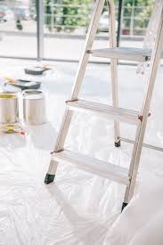 Liked by the question poster. Selective Focus Of Ladder In Room With Cans Of Paint On White Floor Covered With Cellophane Free Stock Photo And Image