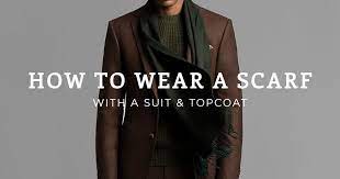 Depending on your personal preference, you can wear the scarf tucked into your outerwear or hanging outside of your jacket or coat. 7 Ways To Wear A Scarf With A Suit For Men Black Lapel