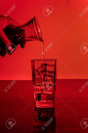 Tumblr is a place to express yourself, discover yourself, and bond over the stuff you love. Pouring Alcohol In A Glass Full Of Ice With Aesthetic Red Background Stock Photo Picture And Royalty Free Image Image 154387758