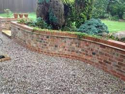 35 Inspiring Retaining Wall Ideas Uses That Will Blow Your Mind Homelovers Brick Wall Gardens Brick Garden Backyard Retaining Walls